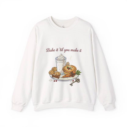 Women’s Sweatshirt - “Bake it ‘til you make it” features cozy dessert and wine-themed embroidery, ideal for fall fashion and holiday gifting.
