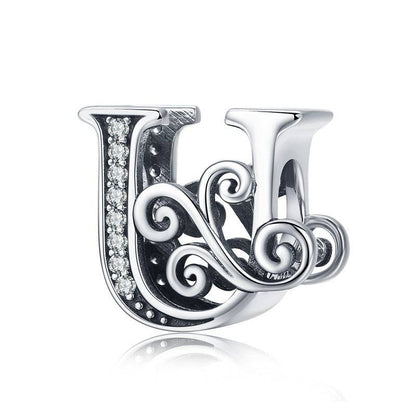 Elegant letter U charm with swirl design