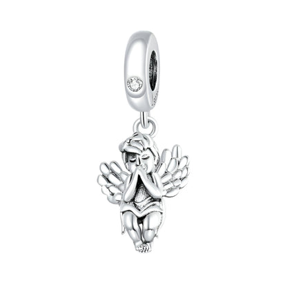 Little Angel Charm in sterling silver featuring a praying angel with detailed wings. A graceful jewelry pendant for spiritual elegance.
