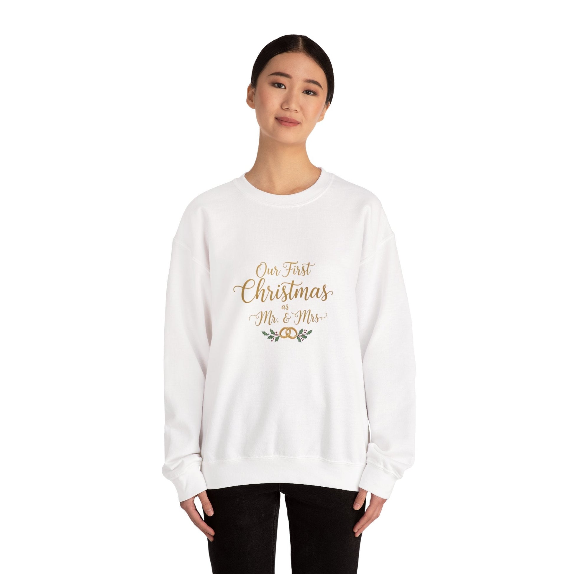 His/Hers Newlyweds Sweatshirt with 'Our First Christmas Mr. & Mrs.' text in gold script, ideal holiday apparel for couples. Cozy unisex crewneck design.