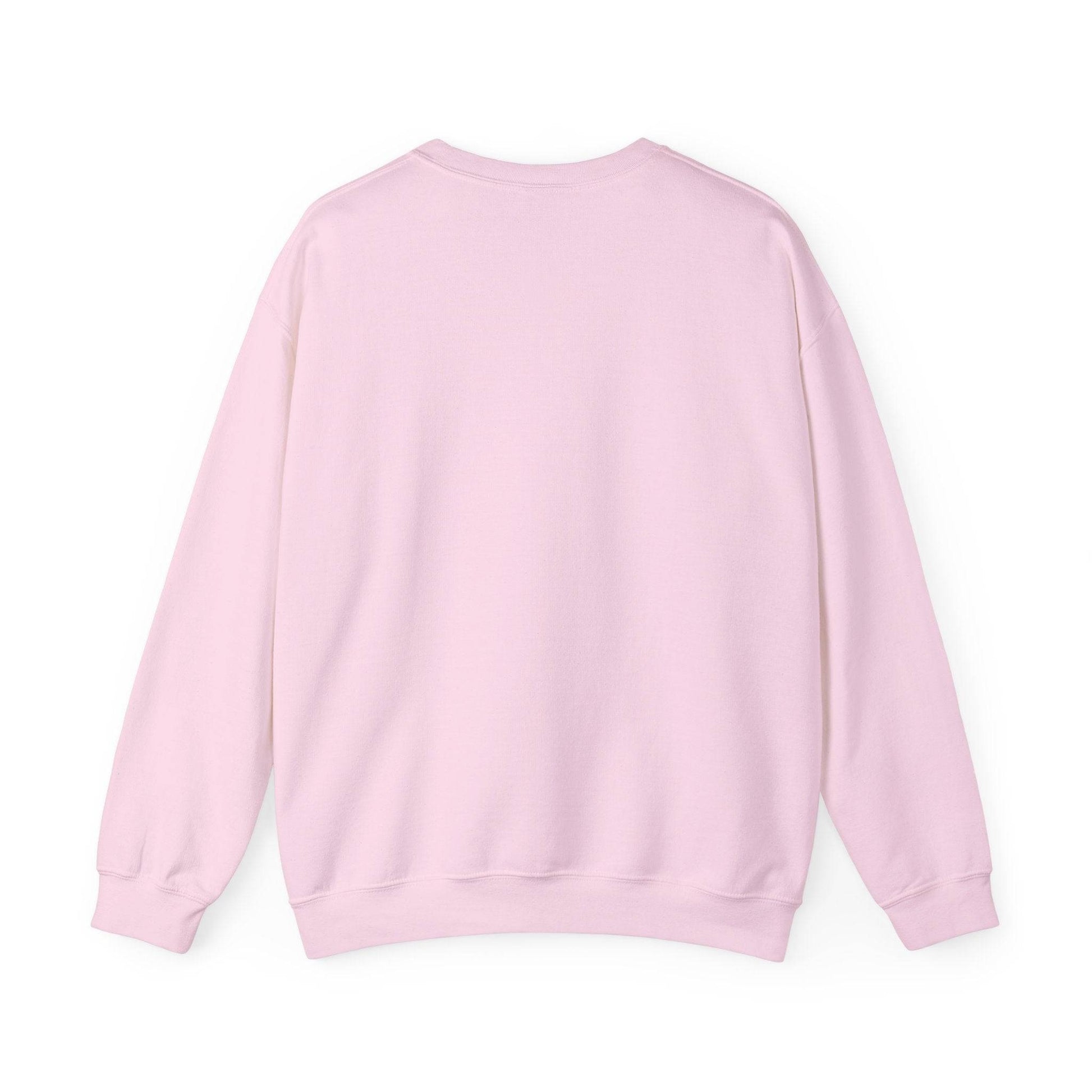 Back view of Women’s Sweatshirt - “Bake it ‘til you make it” in pastel pink, showcasing cozy unisex crewneck design for casual and holiday wear.