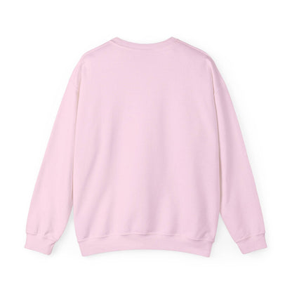 Back view of Women’s Sweatshirt - “Bake it ‘til you make it” in pastel pink, showcasing cozy unisex crewneck design for casual and holiday wear.