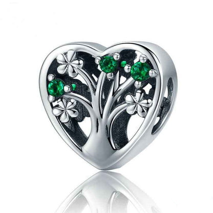 Heart Tree of Life Charm in sterling silver with green gemstones and floral accents, symbolizing strength and growth for charm bracelets.