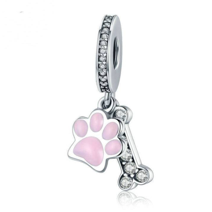 Pink Bone Charm with diamanté bone and pink paw design, crafted in sterling silver. A stylish jewelry piece for pet lovers and charm bracelets.