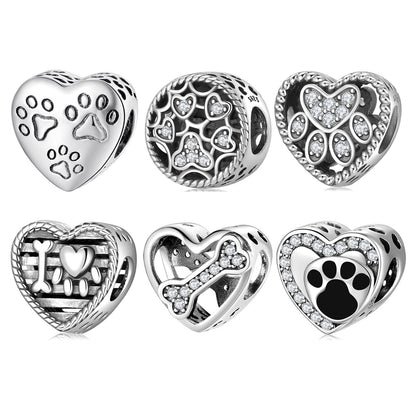 Collection of six pet-themed charms