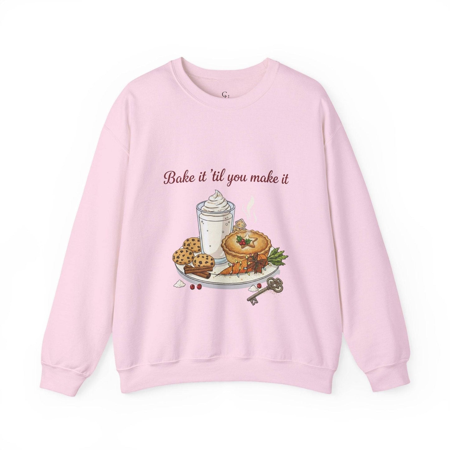 Women’s Sweatshirt - “Bake it ‘til you make it” in light pink with embroidered dessert and wine design, ideal for cozy fall and winter outfits.