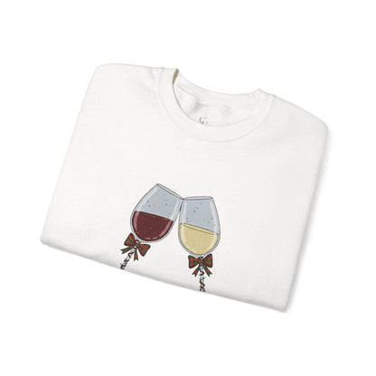 Women’s Christmas Wine Sweatshirt - Holiday Toast | Cozy Crewneck featuring red and white wine glasses with festive bows, folded neatly for display.