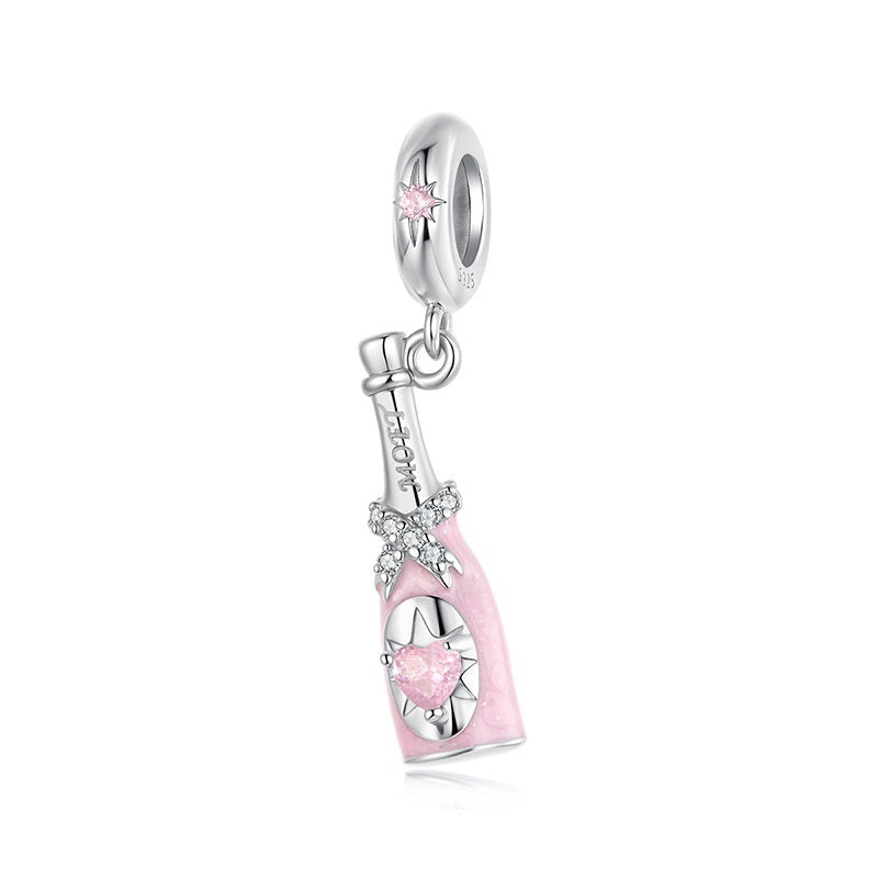 Silver and pink charm with 'Real Sterling Silver 925' stamp on a white background