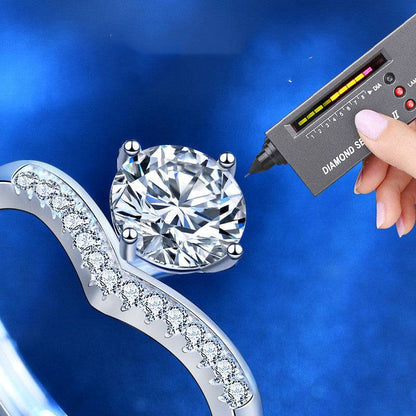 Diamond tester verifying the authenticity of the 1 carat moissanite stone in the Princess Crown Silver Moissanite Ring. Sparkling silver band with accents.