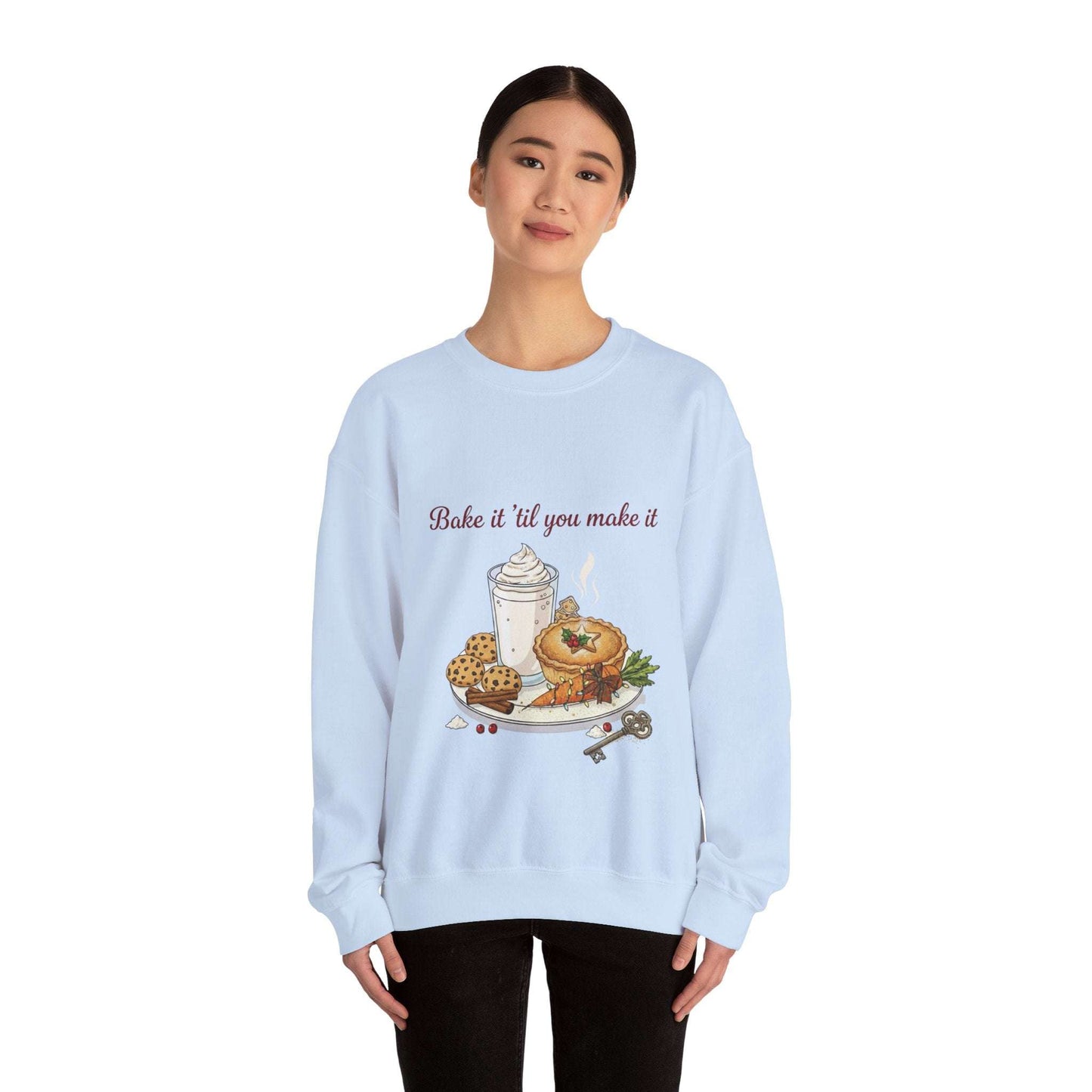 Women’s Sweatshirt - “Bake it ‘til you make it” in light blue with festive baked goods and wine-themed embroidery, perfect for cozy fall fashion.