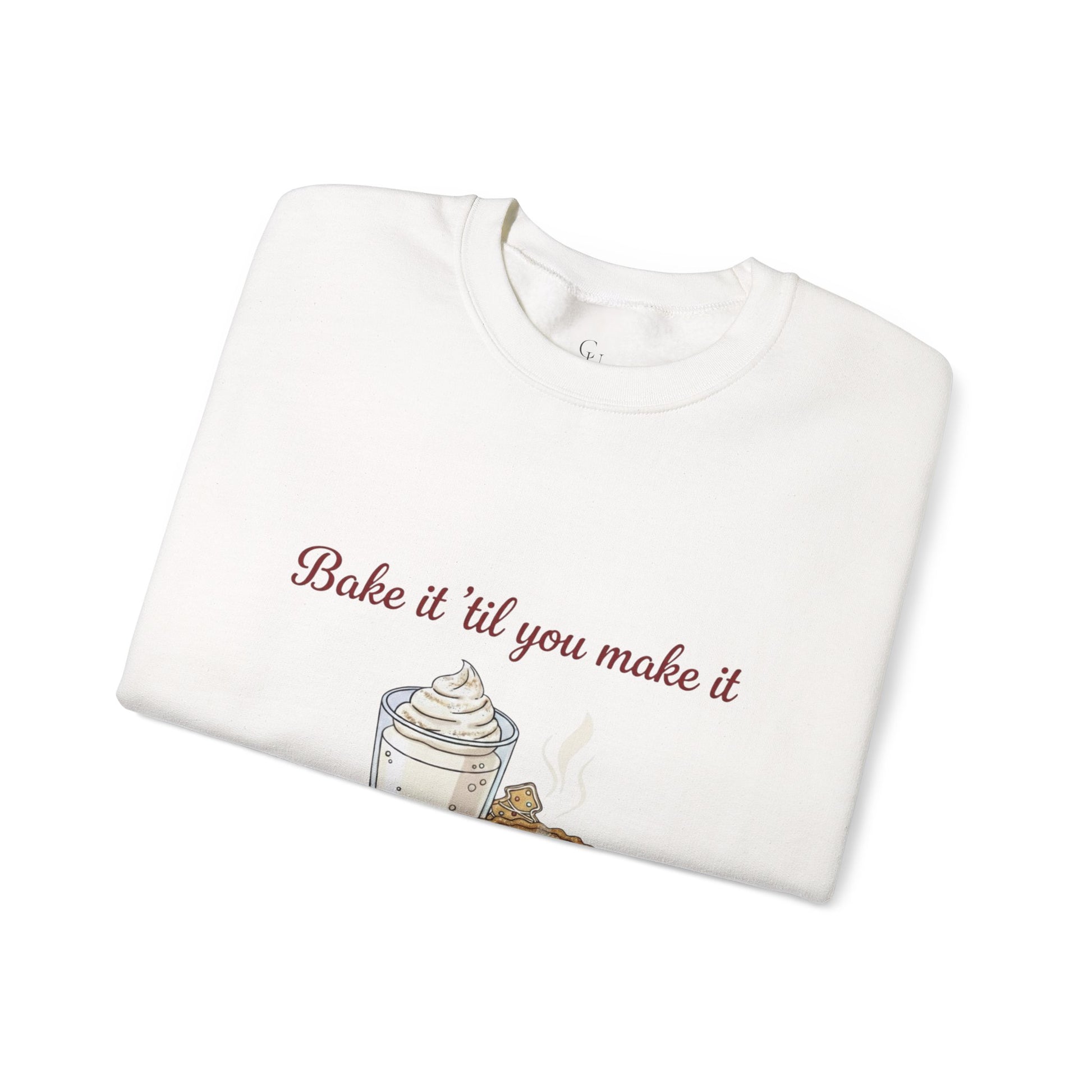 Women’s Sweatshirt - “Bake it ‘til you make it” folded with embroidered whipped cream and cookie design. Cozy holiday apparel for wine lovers and bakers.