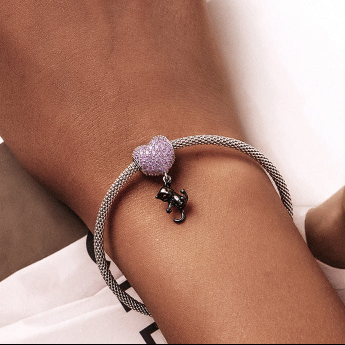 Cat Heart Charm bracelet worn on a wrist, highlighting its elegant and playful appeal. A charming gift for cat lovers and jewelry fans.