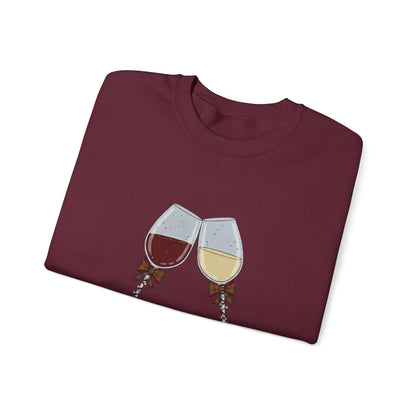 Women’s Christmas Wine Sweatshirt - Holiday Toast design featuring red and white wine glasses clinking with festive ribbons on a maroon crewneck.