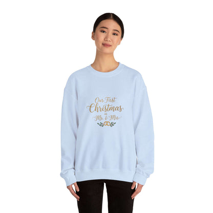 His/Hers Newlyweds Sweatshirt with 'Our First Christmas Mr. & Mrs.' gold embroidery, ideal holiday apparel for couples. Cozy unisex crewneck in light blue.