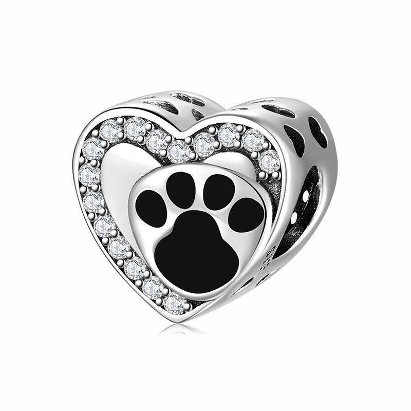 Heart-shaped charm with paw print and crystals