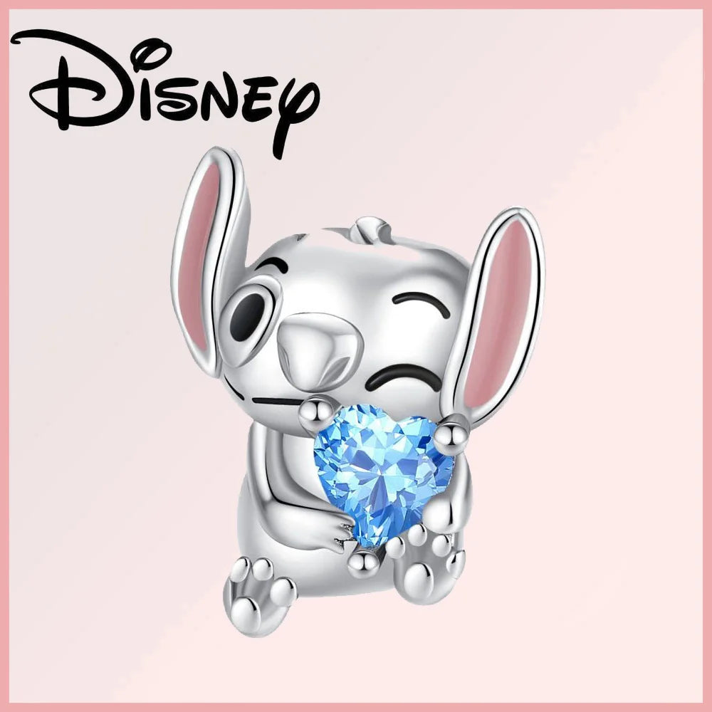 Limited Edition Disney Pixar charm featuring a silver Stitch holding a blue heart-shaped zircon gem. Part of the Disney Pixar Charms Collection.