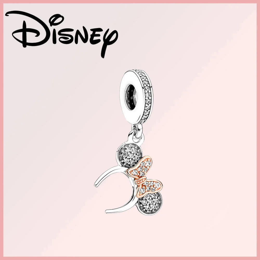 Disney Pixar Charms Collection (Limited Edition) sterling silver charm featuring Minnie Mouse ears with rose gold bow and zircon stones. Elegant Disney-inspired jewelry piece for collectors and fans.