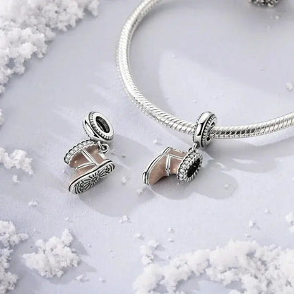 Snow Boot Charm - Winter Accessory | Symbol of Warmth displayed on a silver bracelet with snowflake accents, perfect for seasonal jewelry collections.
