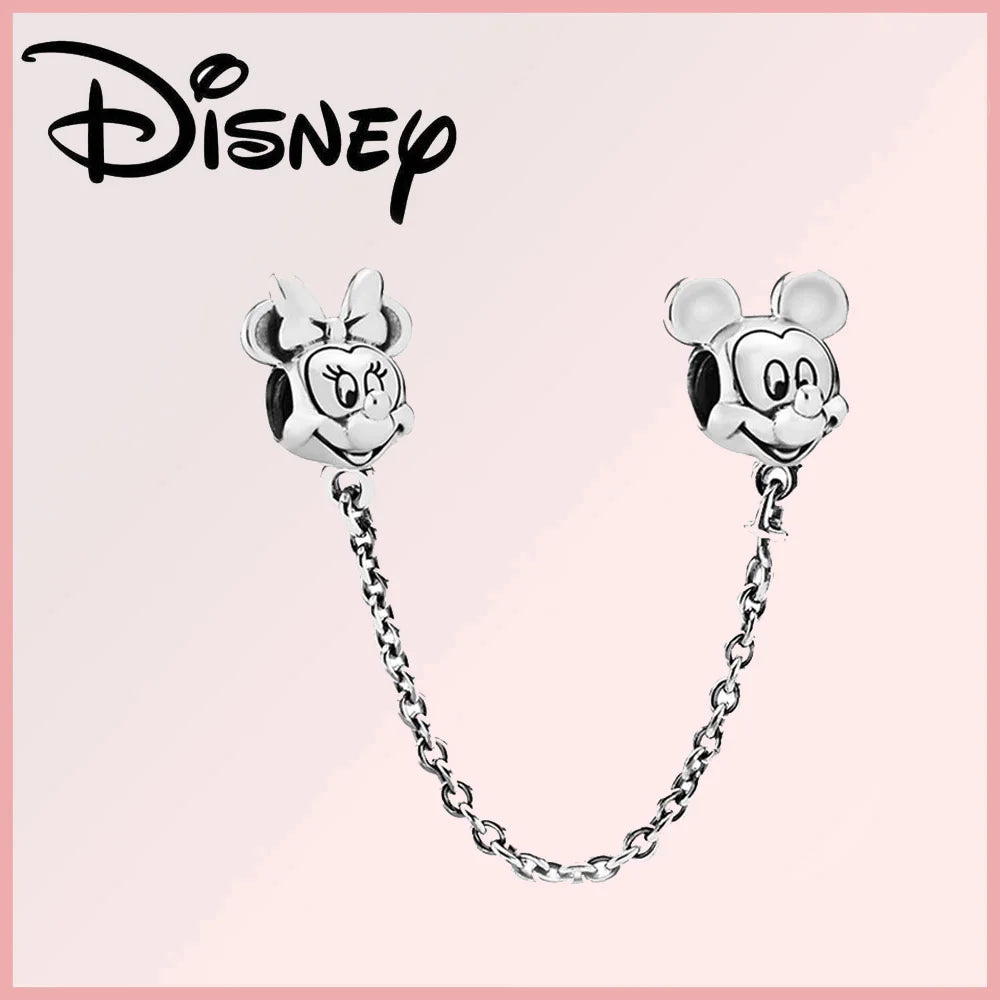 Limited Edition Disney Pixar charm featuring Mickey and Minnie Mouse heads in sterling silver with safety chain. Part of Disney Pixar Charms Collection.