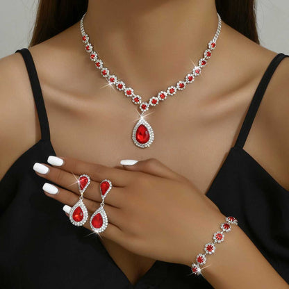 Red Three-piece Jewellery Set - Complete Set | Elegant Trio with teardrop pendant necklace, earrings, and floral bracelet for formal occasions.