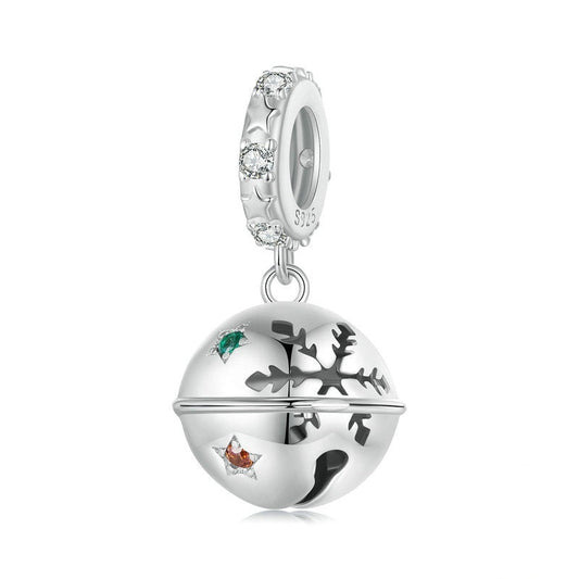 Silver charm with reindeer and snowflake design on a white background