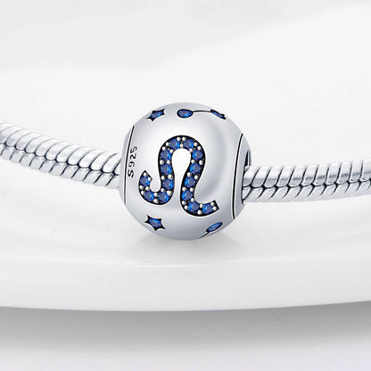 Leo zodiac charm in sterling silver with blue crystal accents, designed for stylish and meaningful jewelry personalization.