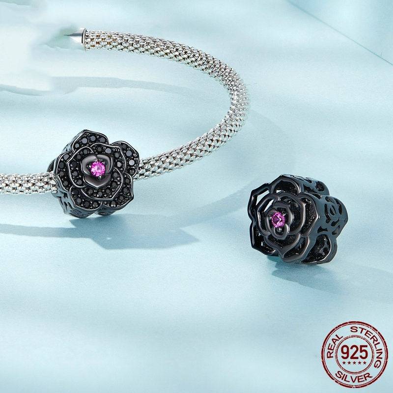 Gothic Charm: Embrace Dark Elegance - Black Rose features a black rose-shaped charm with a purple gemstone center, crafted in 925 sterling silver.