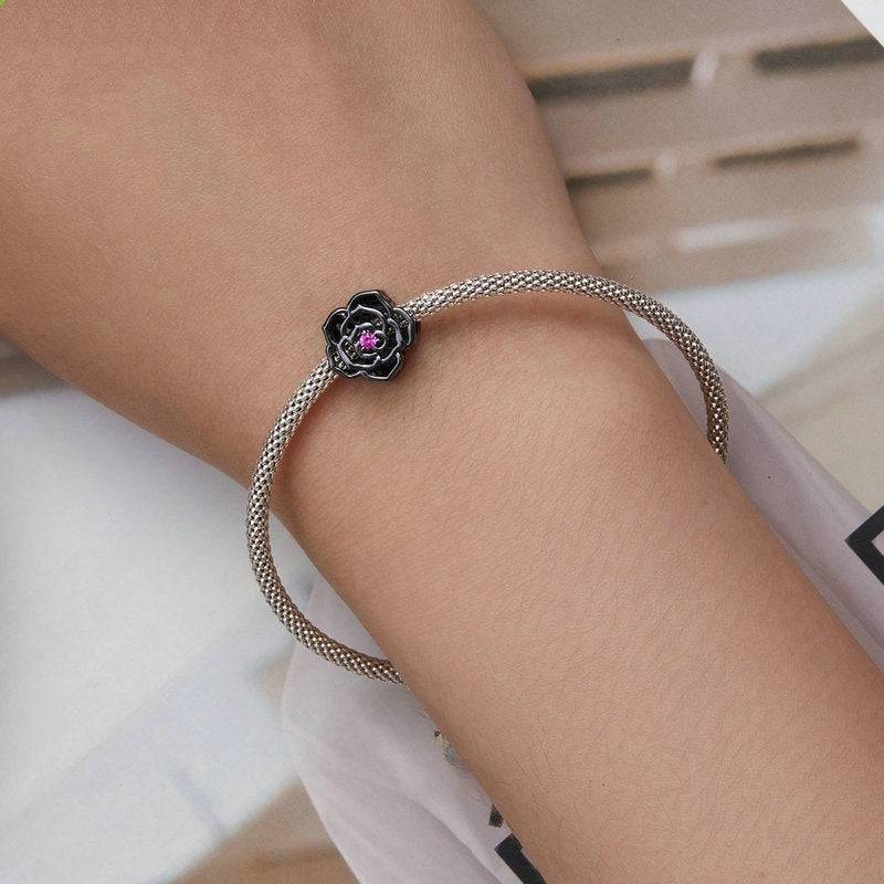 Black Rose Gothic Charm on silver mesh bracelet, showcasing dark elegance in gothic style jewelry. Ideal for unique charm collections.