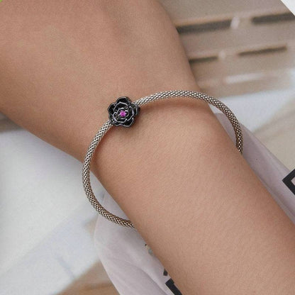 Black Rose Gothic Charm on silver mesh bracelet, showcasing dark elegance in gothic style jewelry. Ideal for unique charm collections.