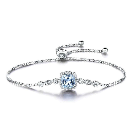Silver Topaz Bracelet featuring a cushion-cut topaz centerpiece with adjustable chain and delicate crystal accents. Elegant wrist jewellery for any occasion.