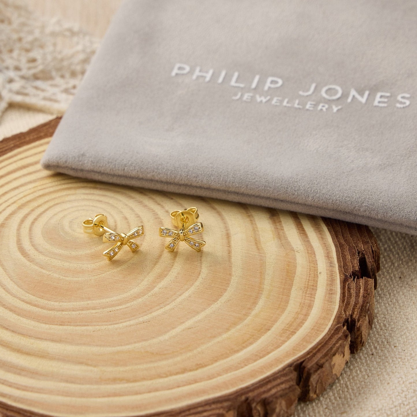 Gold Plated Bow Earrings Created with Zircondia® Crystals