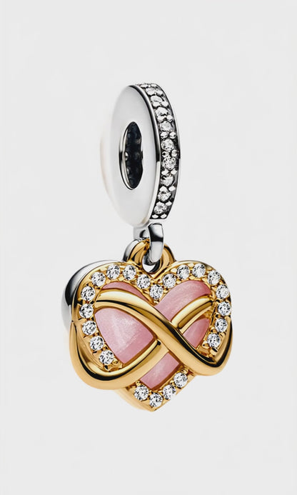 Close-up of Infinity Heart Dangle Charm - Symbol of Endless Love ♾️ showing detailed gold and crystal infinity design over a pink heart.