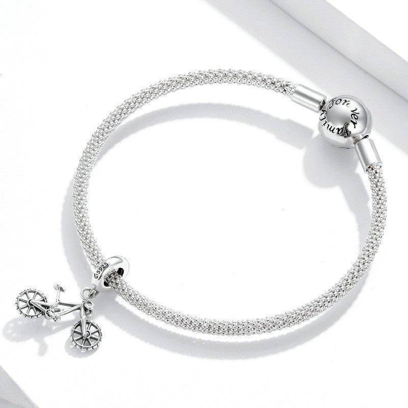 Bike charm on a silver bracelet