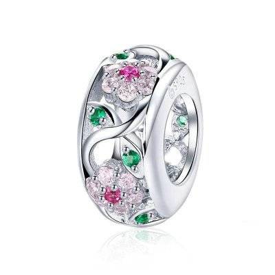 Floral charm with pink and green crystals