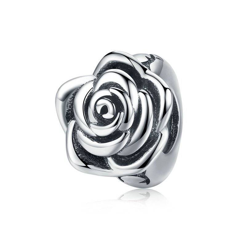 Silver rose charm with intricate details