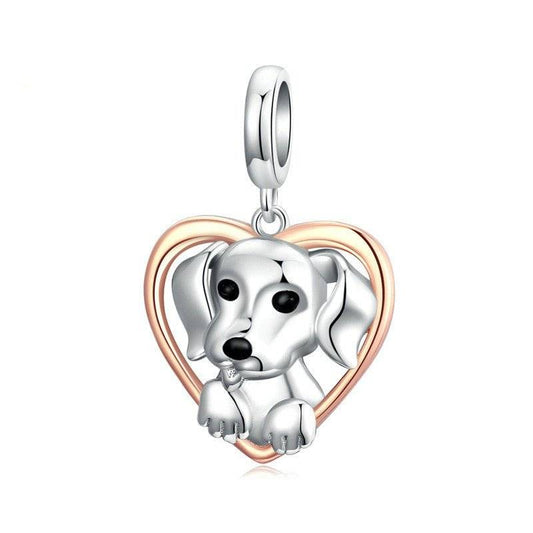 Silver puppy charm with heart design